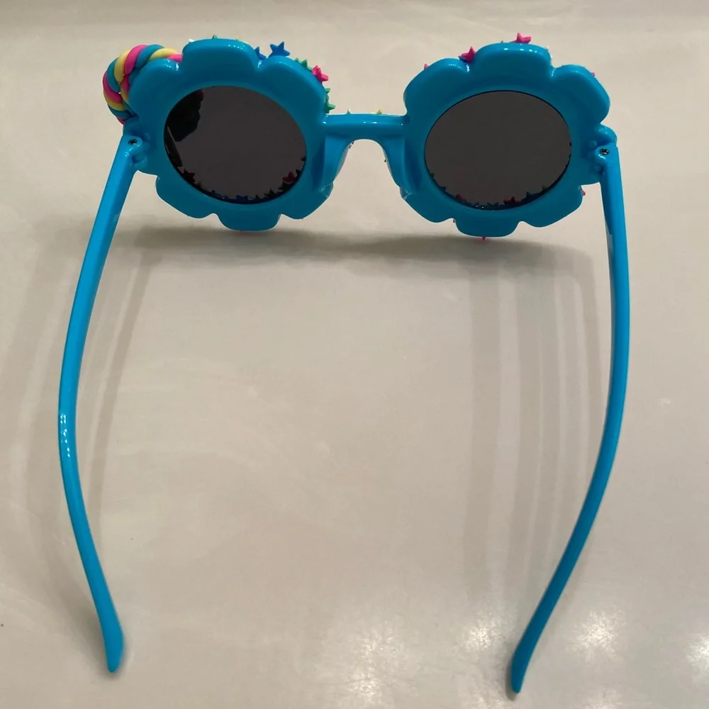 Girls electric blue flower shaped sunglasses